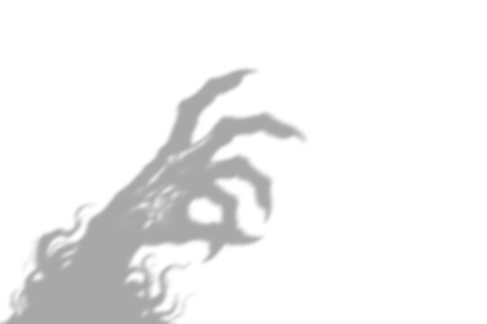 A dark scary shadow of a monster hand making an okay gesture with sharp claws cast on a wall shown isolated on transparent background