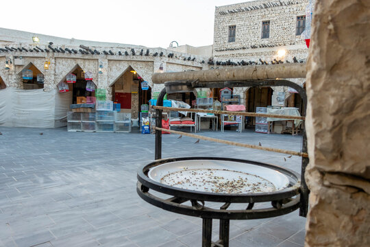 Doha, Qatar - Souq Waqif in Doha, Qatar, showcasing its traditional Qatari architecture, narrow pathways, heritage buildings, shops, and vibrant atmosphere. 