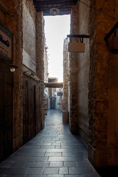 Doha, Qatar - Souq Waqif in Doha, Qatar, showcasing its traditional Qatari architecture, narrow pathways, heritage buildings, shops, and vibrant atmosphere. 