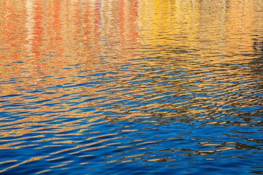 Ripples and colorful reflections on water in bastia corsica