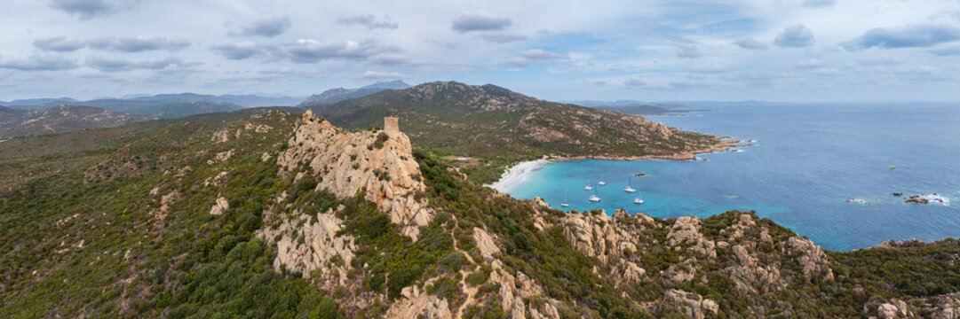 Genoese tower overlooking cala di roccapina bay in corsica, france