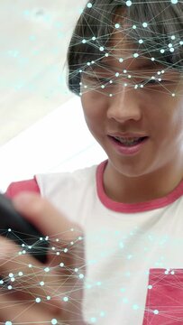Vertical video: Teen male tapping phone and starting network overlay while reacting in tech demo