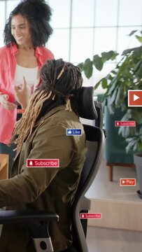 Vertical video: Woman pointing, causing man turning and viewing tablet for work while icons popping