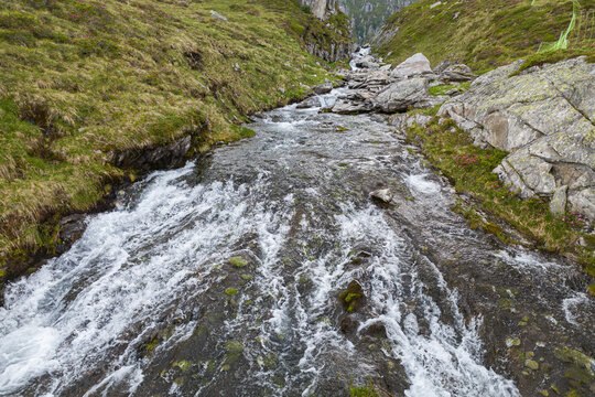 Alpine wilderness and mountain stream, rushing water in the Kitzb&uuml;hel Alps of Austria, pristine nature and hiking destination in Hohe Tauern National Park