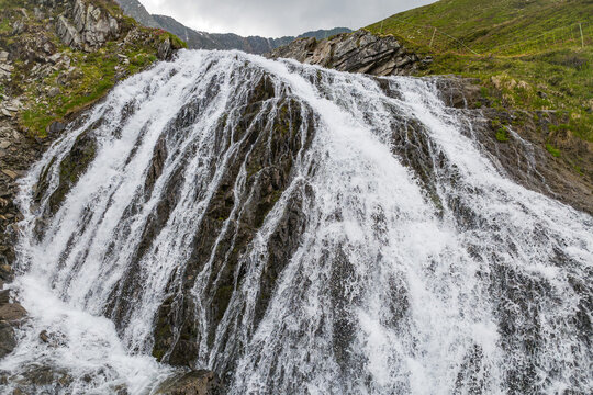 Alpine waterfall in the Kitzb&uuml;hel Alps, pristine mountain stream and wilderness landscape in Hohe Tauern National Park, Austria, scenic nature and travel destination