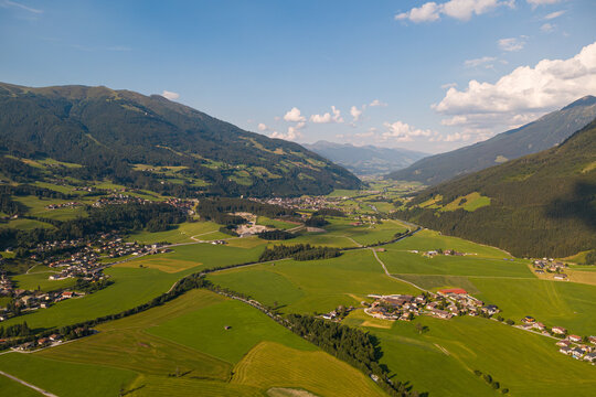 Alpine landscape and travel destination, aerial view of Kitzb&uuml;hel Alps in Tyrol Austria with green meadows and mountain valley villages in summer