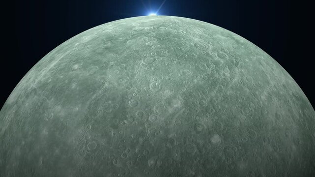 Sunlight rising over the cratered surface of the planet Mercury
