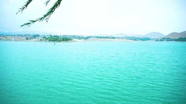 Scenic View of Qargha Reservoir with Turquoise Water, Mountains and Greenery