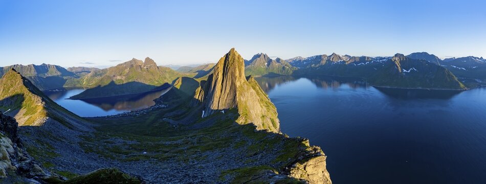 Panorama, iconic mountain Segla with steeply sloping cliffs, mountain landscape at Medfjorden fjord and &Oslash;rnfjorden, in evening light at sunset, Senja island, Troms, Norway