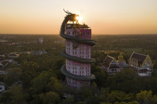 Aerial view, sun in the mouth of a dragon, Wat Samphan dragon temple, Bangkok, Thailand