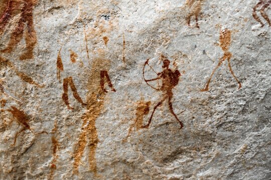 Prehistoric hunter with bow, ancient rock carving of the San, indigenous people of South Africa, Seville Rock Art Trail, Cedar Mountains, Clanwilliam, Western Cape, Republic of South Africa