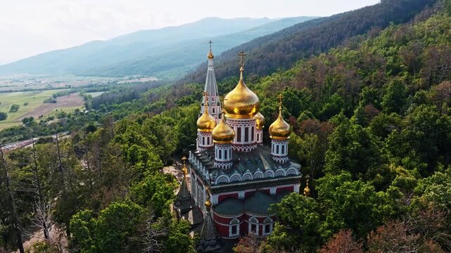 Orthodox Shipka Memorial Church Aerial Drone View Golden Domes Stara Planina Foothills Forest Landscape Shipka Bulgaria Historical Memorial Temple Birth Of Christ Summer