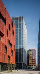 Fototapeta premium Modern Urban Architecture with Red Patterned Facade and Glass Skyscraper ideal for real estate marketing and urban development projects.