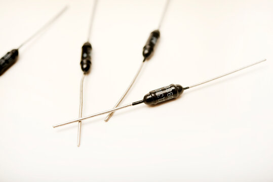 Old diodes. Black metal diodes. Old semiconductors with axial leads.