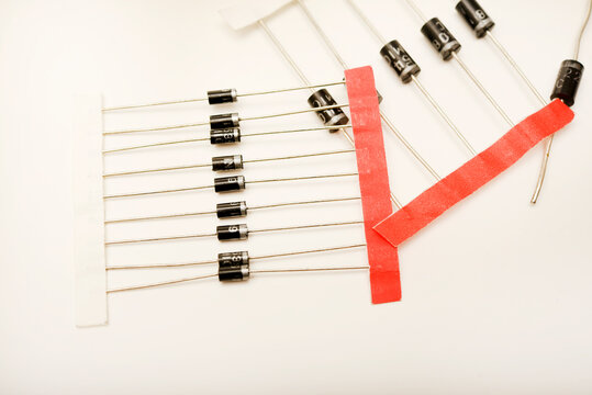 New diodes. Black plastic diodes. Semiconductors with axial leads.