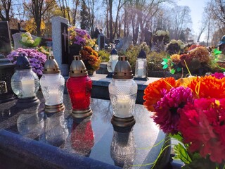 Grave candles at a cemetery on All Saints Day (Wszystkich Swietych) in Warsaw, Poland.