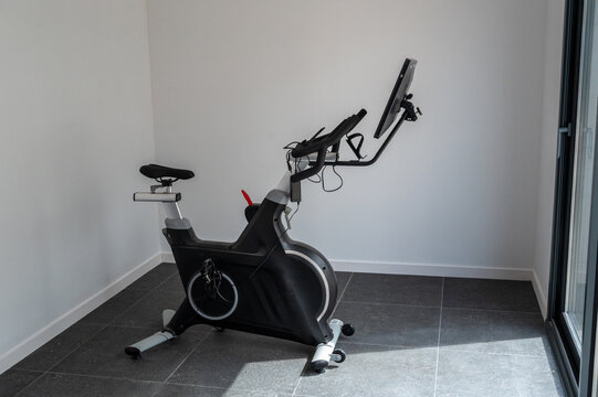 Exercise bike with screen in a modern home gym