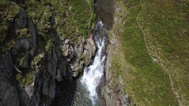Alpine waterfall and mountain stream in Hohe Tauern National Park, Austria