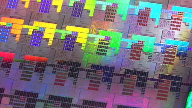 High-tech Macro Photography of a Colorful Silicon Wafer with Microchip Patterns for AI Hardware and Semiconductor Industry Concept.