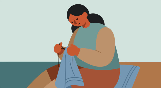 Person crafting with yarn and needles
