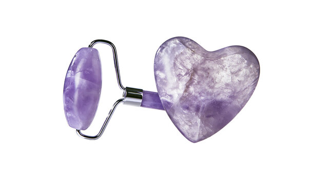 Isolated amethyst facial roller and heart gua sha stone for beauty skincare routine