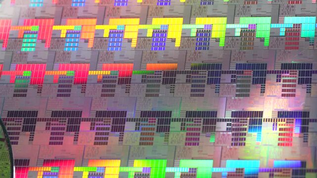 High-tech Macro Photography of a Colorful Silicon Wafer with Microchip Patterns for AI Hardware and Semiconductor Industry Concept.