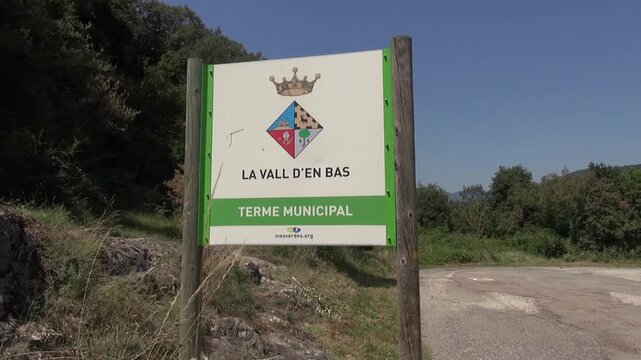 Sign La Vall d'En Bas Catalonia municipality countryside nature road wood