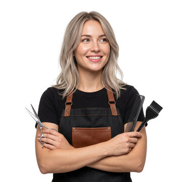 Young female hairdresser smiling, holding scissors and comb, isolated