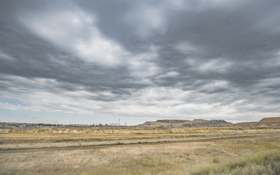 Industrial mining quarry in the wild Kazakh steppes; large-scale industrial excavation spoil heaps