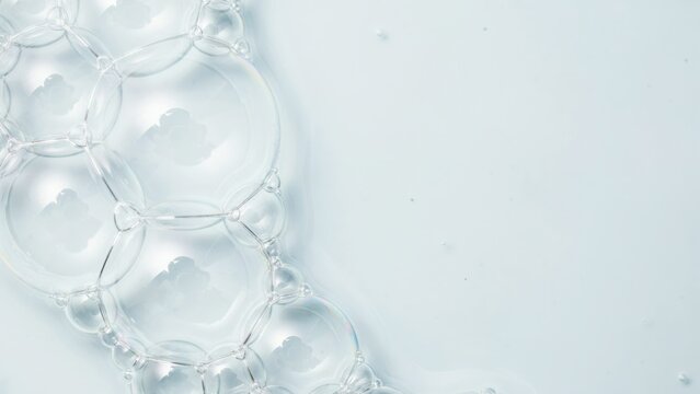 Macro shot of soap bubbles on a light blue background