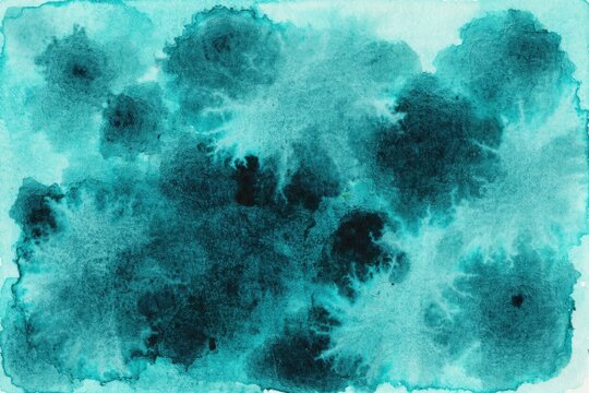 Abstract teal watercolor background with dark blue ink bleeds and artistic texture