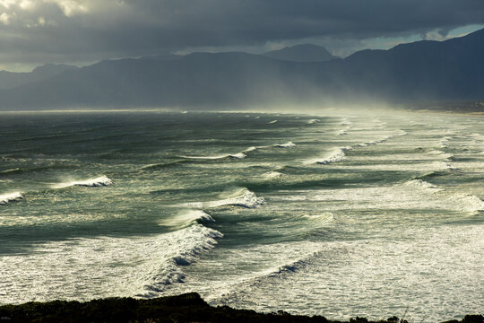 aerial view of massive wave sets rolling into Walker Bay Nature Reserve, South Africa 