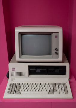 IBM personal computer (1981) is the first microcomputer released in the IBM PC model line. Pink background.