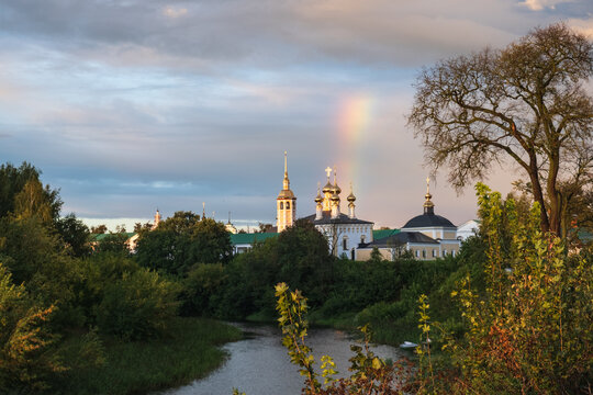 picturesque view of suzdal temple complex with high domes and rainbow in sky. historic suzdal shows beautiful russian architecture and nature. suzdal is amazing travel destination