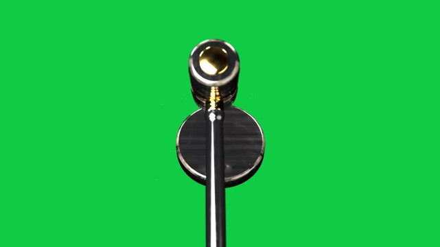 Cam zooming rod rotating tilting gold head specks rising disc gleaming showing sheen on transparent