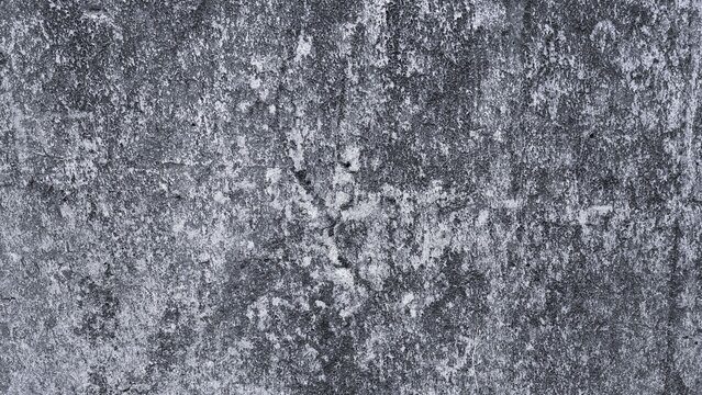 Rugged concrete wall texture with layered stains, coarse grain and irregular surface marks, rendered in monochrome for an aged industrial look.
