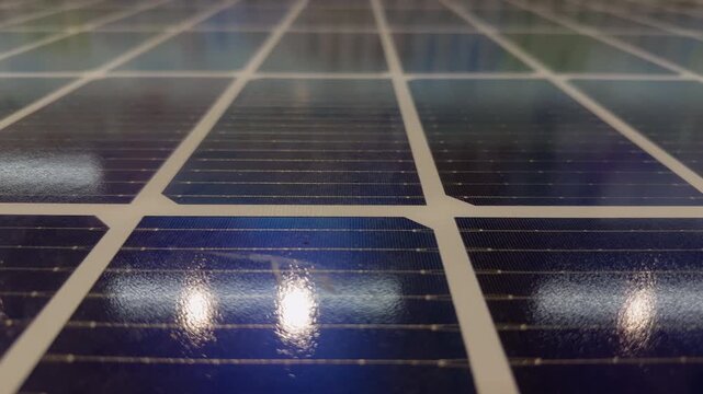 Reflective Solar Panel Cells Capture Light in a Close Surface View, Showing Renewable Energy Technology and Sustainable Power Generation