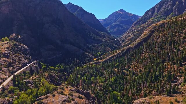 Aerial view overlooks canyon mountains and forests along Million Dollar Highway Colorado