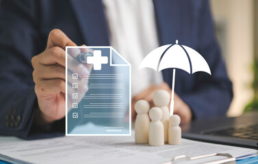 Health insurance policy interface with businessperson signing beside family figurines and umbrella representing medical coverage financial protection risk management claims and future security. © Custard Pixel