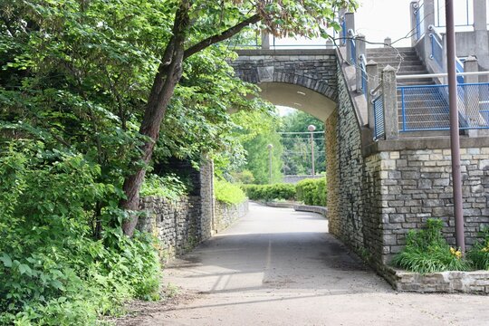 The empty walkway in the park on a sunny day.