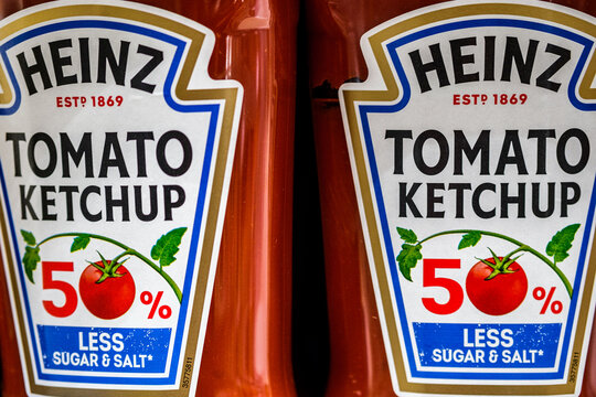 Close-Up of Two Bottles Of Heinz Tomato Ketchup With Fifty Percent Less Sugar And Salt