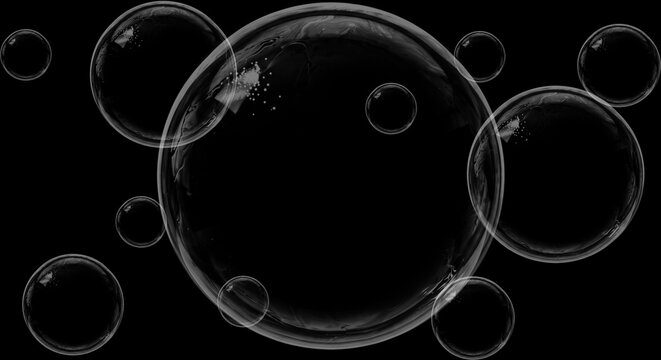 Transparent soap bubbles floating in dark space featuring glossy reflections and soft circular shapes on black background