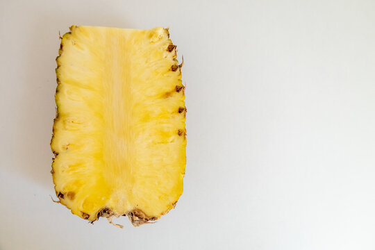 Halved pineapple on a white background horizontal composition