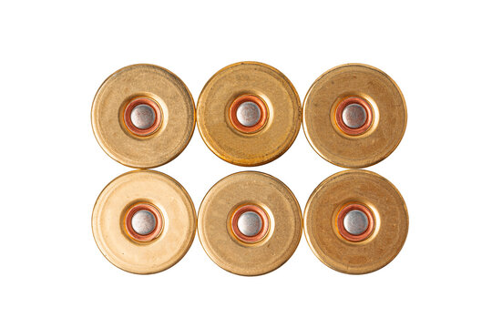 Various shotgun shell casings arranged in a row on a white background