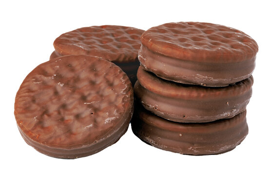 Chocolate cookies stacked on a white background with a soft texture and round shape