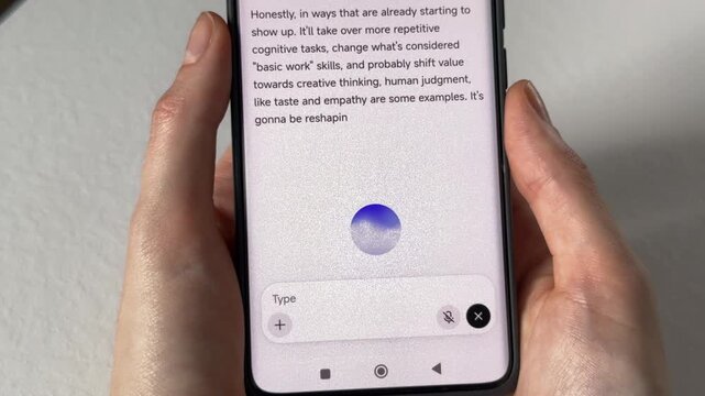 Receiving instant acoustic audio feedback from an artificial intelligence generative voice model application. White mobile smartphone screen running a conversational assistant system to process smart