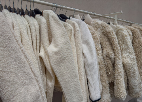 Winterfashion Fluffy faux fur winter jackets on a clothes rack in a department store