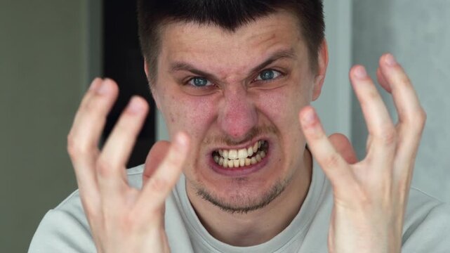 An angry man is shouting and expressing dissatisfaction.
Display of negative emotions.