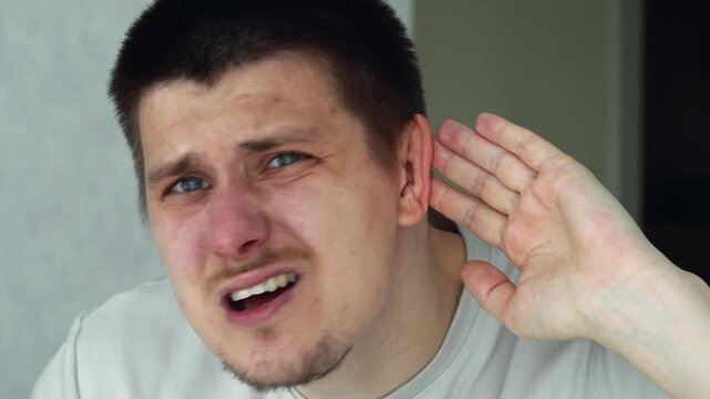 A man is experiencing hearing problems.
He does not hear when someone speaks to him.