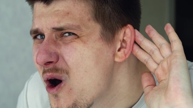 A man is experiencing hearing problems.
He does not hear when someone speaks to him.